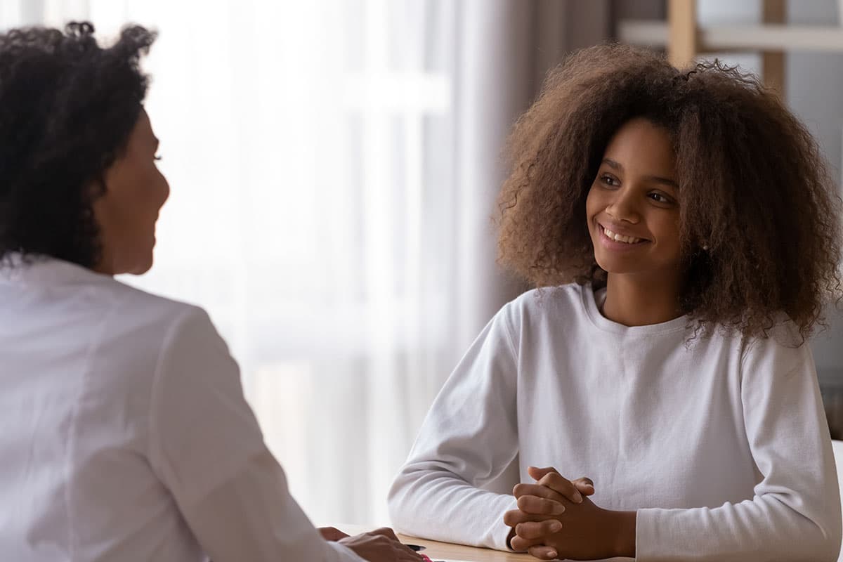 a counselor and teen talk during an IOP Treatment program