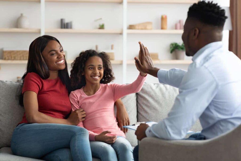 a psychologist meets with a parent and child