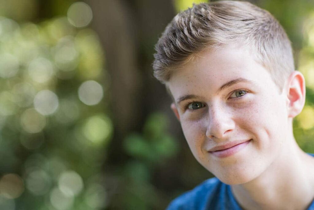 a teen smiles after reviewing dialectical behavior therapy options
