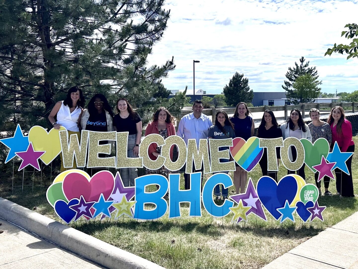 welcome sign with staff team